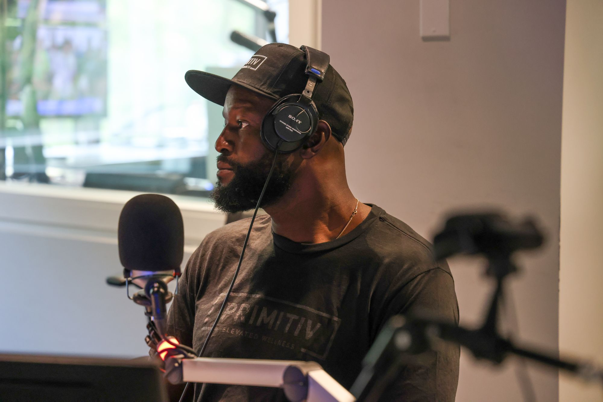 Gosder Cherilus speaking on a podcast
