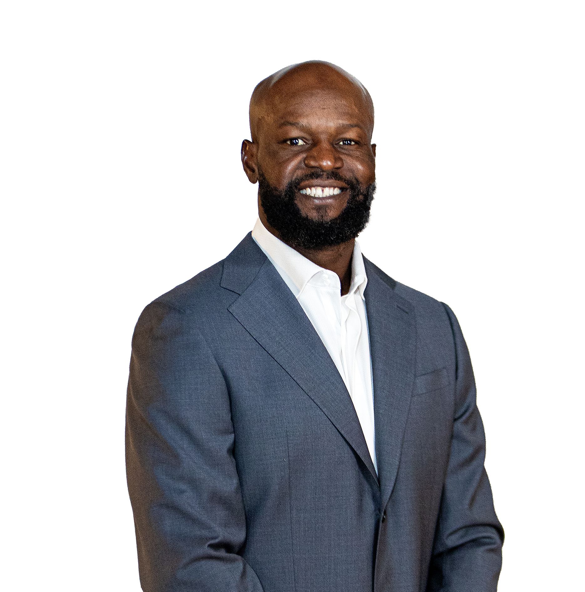 Gosder Cherilus, founder of Bastion Companies, in a blue suit